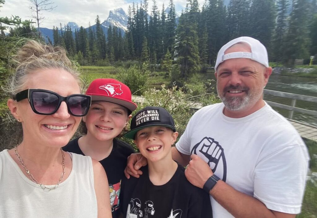 Erin Chalmers with Husband and two son